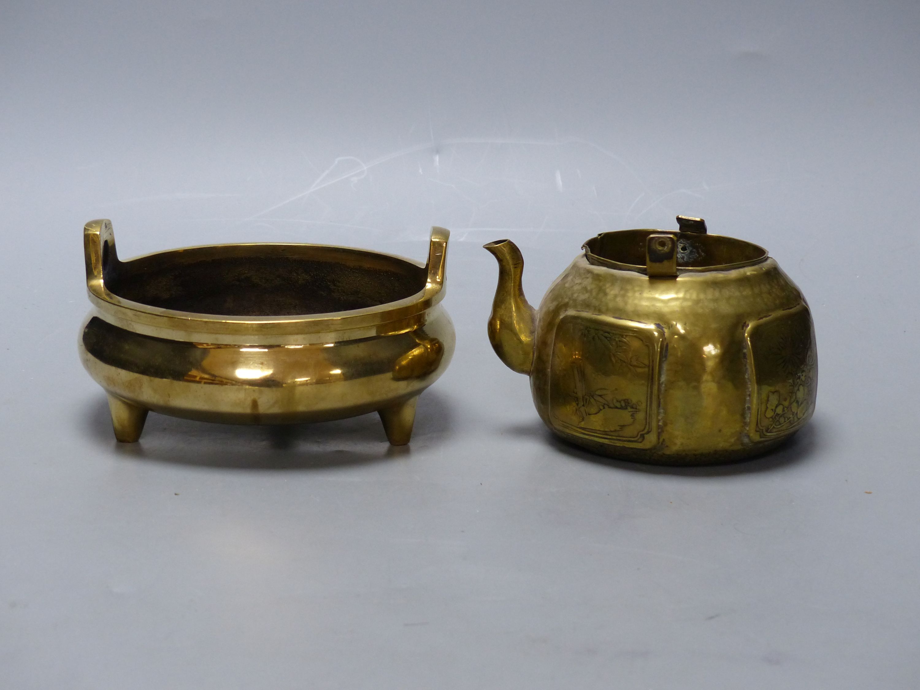 A Chinese bronze censor with Xuande mark, diameter 15cm, and a brass tea pot